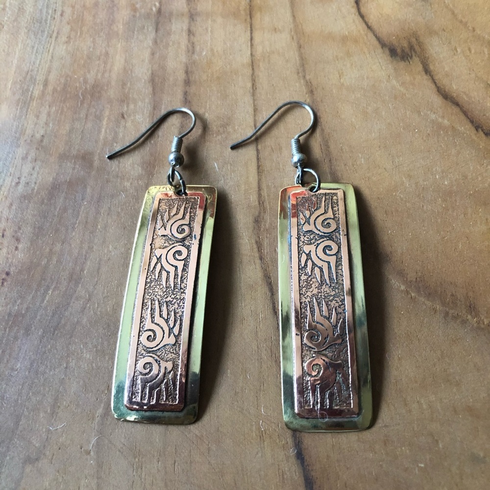 Copper plated hanging earrings with wing design